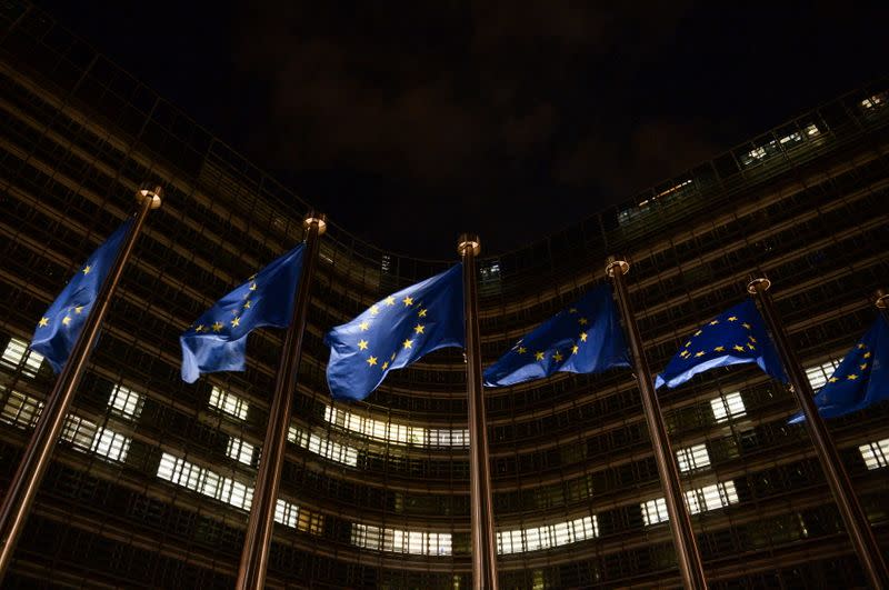 European Union flags flutter in front of the European Commission headquarters, in Brussels