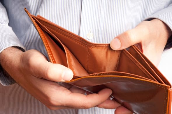 man showing an empty wallet