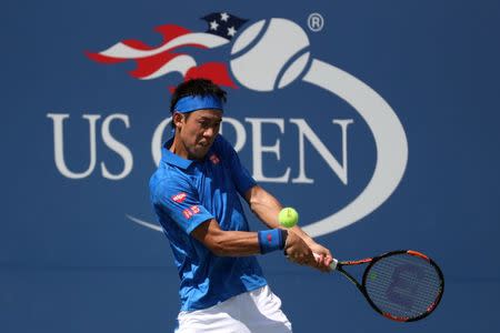 Aug 30, 2016; New York, NY, USA; Kei Nishikori of Japan hits a backhand against Benjamin Becker of Germany (not pictured) on day two of the 2016 U.S. Open tennis tournament at USTA Billie Jean King National Tennis Center. Geoff Burke-USA TODAY Sports