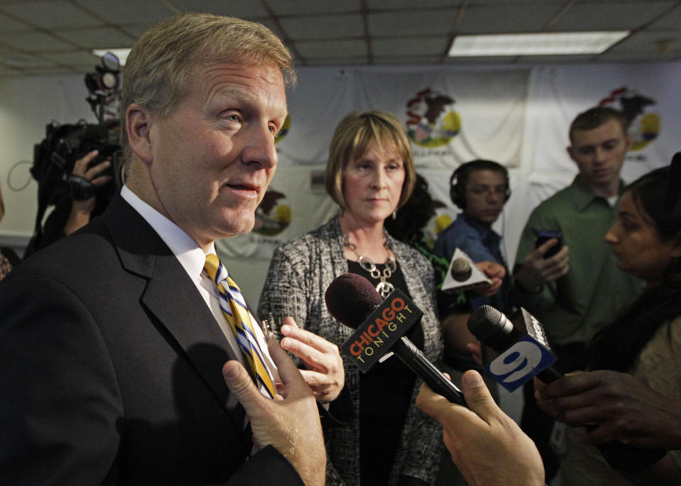 Illinois House Minority Leader Tom Cross speaks with reporters as Senate Minority Leader Christine Radogno looks on after top Illinois lawmakers met with Gov. Pat Quinn in Chicago, Wednesday, June 6, 2012, to talk about pension reform. The lawmakers left the meeting divided over what approach to take. They were close to agreement last week, but that was derailed shortly before the end of the legislative session. The biggest dispute is over whether to make downstate and suburban Chicago schools take over the cost of employee pensions. Illinois pays those expenses now. (AP Photo/M. Spencer Green)