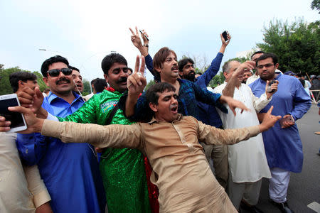 Opponents of Pakistan's Prime Minister Nawaz Sharif react after the Supreme Court's decision to disqualify Sharif, in Islamabad, Pakistan July 28, 2017. REUTERS/Faisal Mahmood