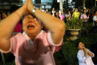 People weep after an announcement that Thailand's King Bhumibol Adulyadej has died, at the Siriraj hospital in Bangkok, Thailand, October 13, 2016. REUTERS/Athit Perawongmetha