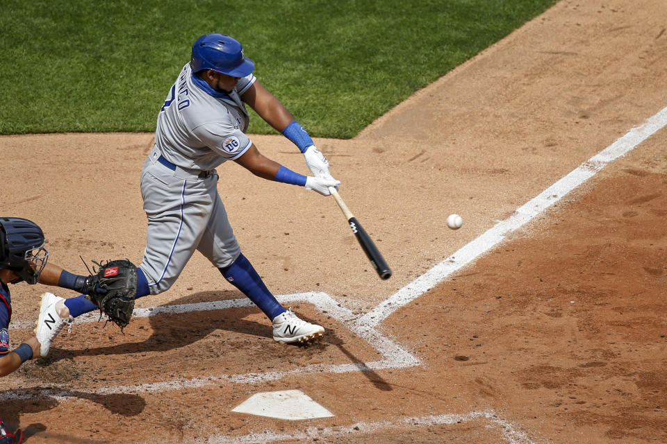 Kansas City Royals' Maikel Franco hits a two run homer against the Minnesota Twins in the fifth inning of game one of a baseball double-header Saturday, Aug. 15, 2020, in Minneapolis. The Twins won 4-2. (AP Photo/Bruce Kluckhohn)