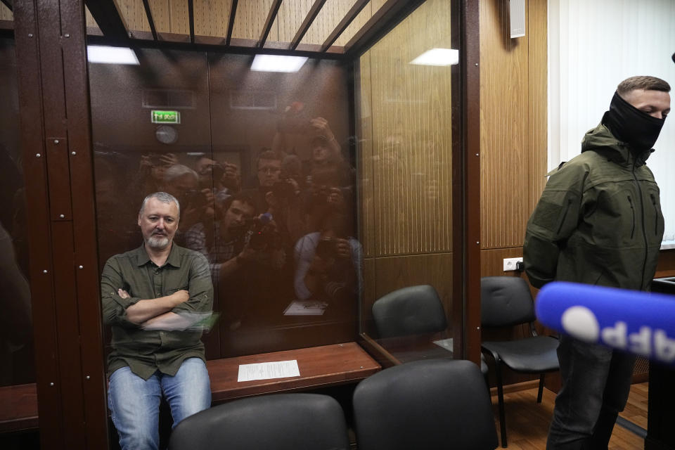 Igor Girkin also know as Igor Strelkov, the former military chief for Russia-backed separatists in eastern Ukraine, sits in a glass cage in a courtroom at the Moscow's Meshchansky District Court in Moscow, Russia, Friday, July 21, 2023. A prominent Russian hard-line nationalist who accused President Vladimir Putin of weakness and indecision in Ukraine was detained Friday on charges of extremism, a signal the Kremlin has toughened its approach with hawkish critics after last month's abortive rebellion by the Wagner mercenary company. (AP Photo/Alexander Zemlianichenko, Pool)