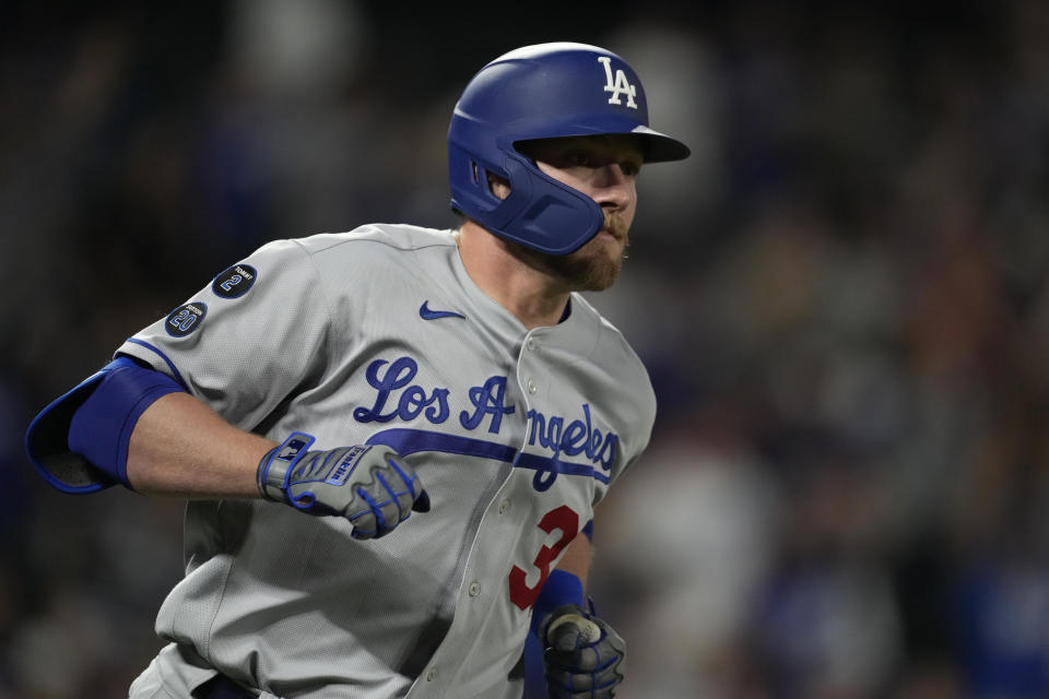 Los Angeles Dodgers' Luke Raley circles the bases after hitting a two-run home run off Colorado Rockies starting pitcher German Marquez in the fourth inning of a baseball game Wednesday, Sept. 22, 2021, in Denver. (AP Photo/David Zalubowski)