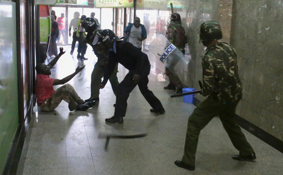 Policemen beat a protester during clashes in Nairobi, Kenya, May 16, 2016. (Reuters/Goran Tomasevic)