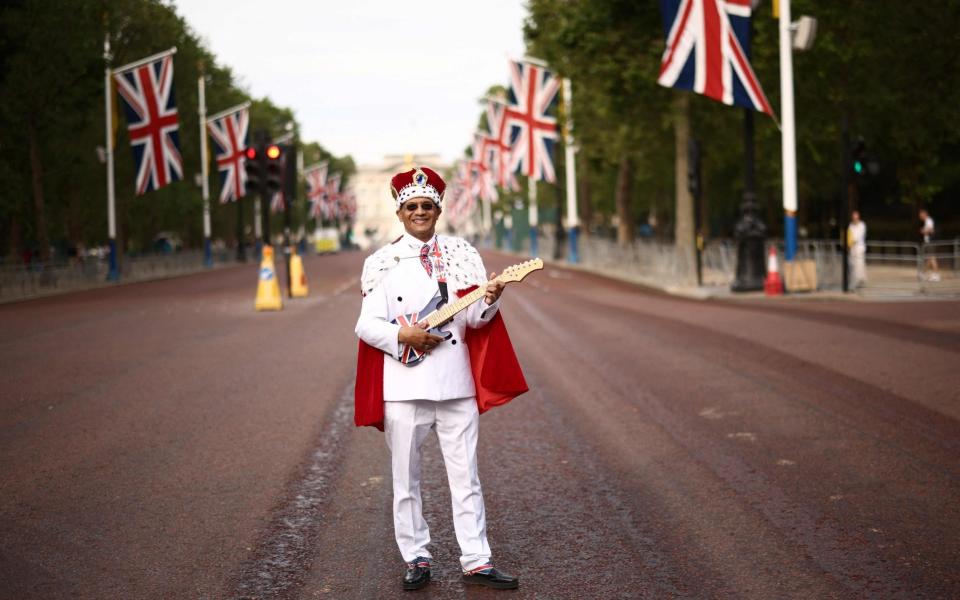 Royal Fan Andrew Thompson poses on The Mall prior to the King's Birthday Parade, 'Trooping the Colour', in London - HENRY NICHOLLS/AFP via Getty Images