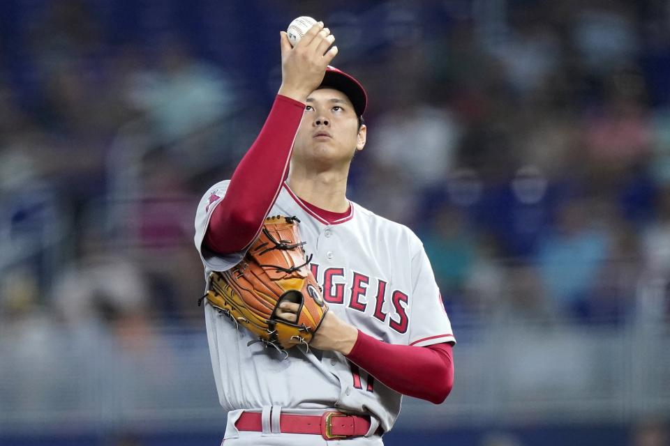 Angels starter Shohei Ohtani prepares to throw during the first inning of Wednesday's game against the Marlins. He  struck out 10, yielding two hits and one unearned run in seven innings.