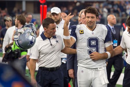 Nov 26, 2015; Arlington, TX, USA; Dallas Cowboys quarterback Tony Romo (9) leaves the game with an injury during the second half of an NFL game against the Carolina Panthers on Thanksgiving at AT&T Stadium. Mandatory Credit: Jerome Miron-USA TODAY Sports