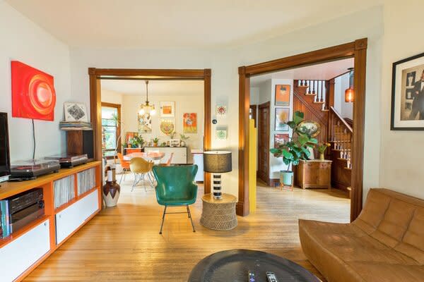 The lower level offers a spacious, open layout, where refinished hardwood floors run throughout.