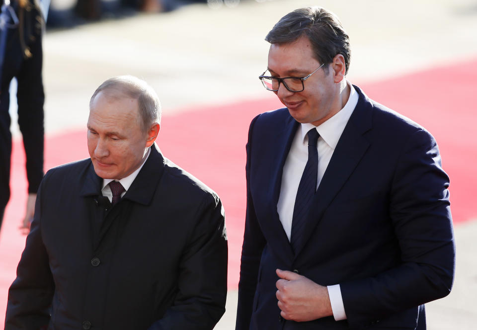 Serbian President Aleksandar Vucic, right, and Russian President Vladimir Putin attend an official welcome ceremony prior to their talks in Belgrade, Serbia, Thursday, Jan. 17, 2019. Putin arrives in Serbia on Thursday for his fourth visit to the Balkan country since 2001. (AP Photo/Darko Vojinovic)