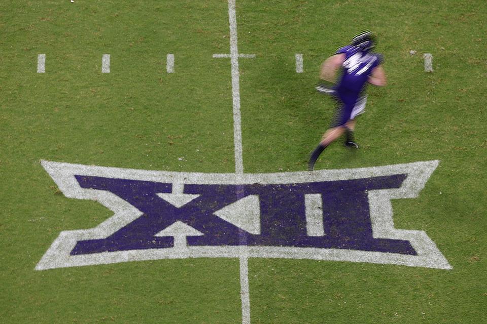 TCU tight end Carter Ware (47) runs across a Big 12 Conference logo during a 45-3 win against Duquesne on Sept. 4, 2021, in Fort Worth, Texas.