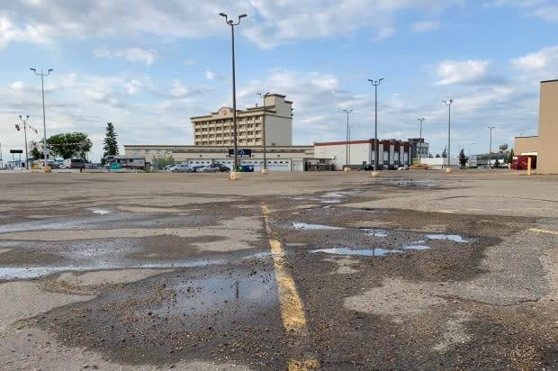 Edmonton police were called to the parking lot of a hotel located near Calgary Trail and 53rd Avenue.  (Dave Bajer/CBC News - image credit)