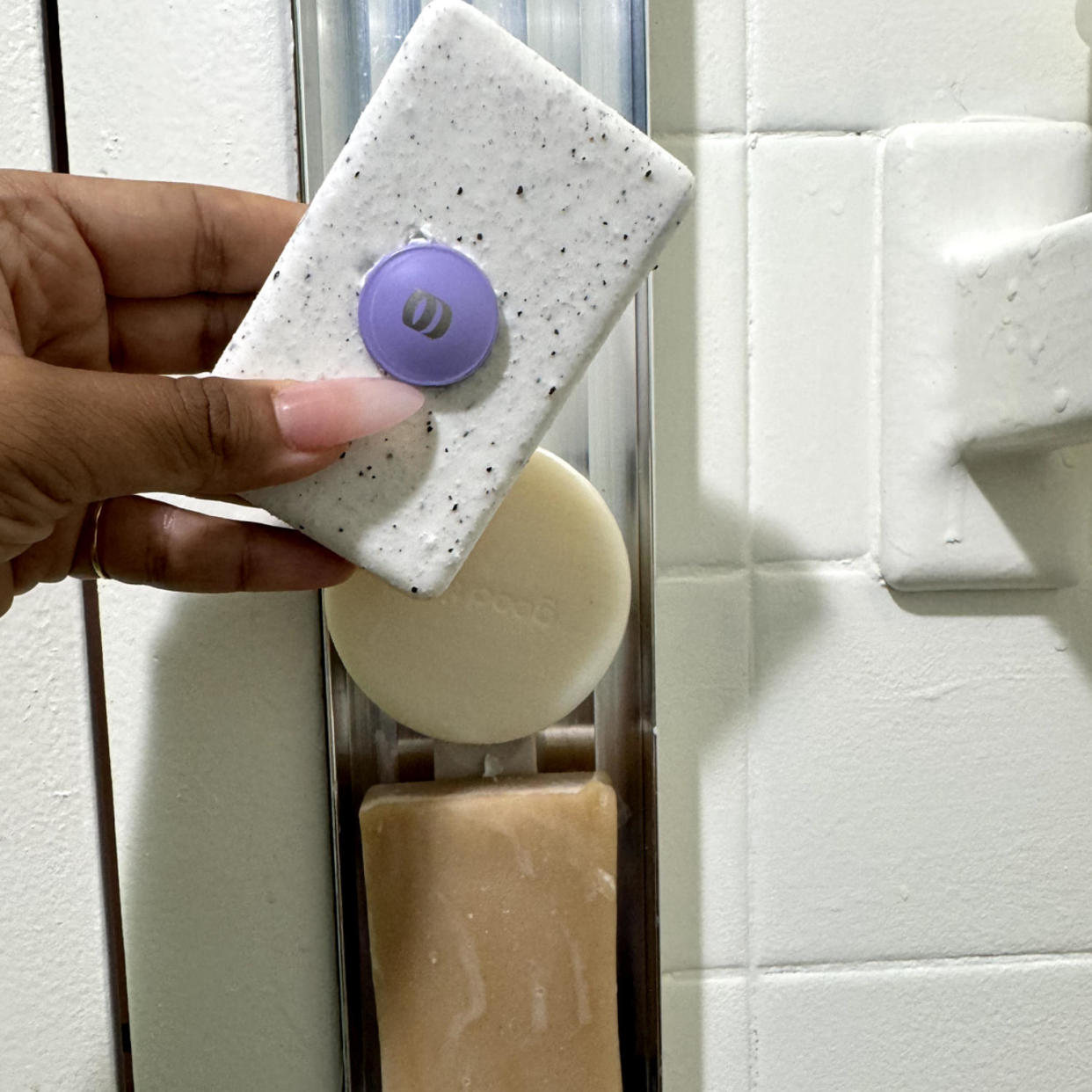 An editor holding a wet bar of soap in her hand. (Courtesy Nikki Brown, SEO Editor)