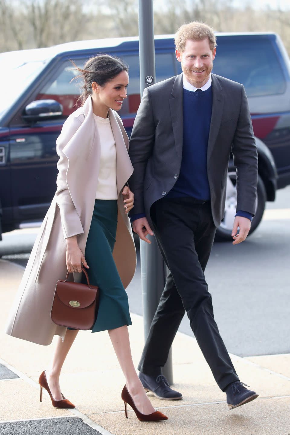 <p>Some people might not be able to cope with Meghan's <a href="https://www.cosmopolitan.com/uk/fashion/celebrity/a19571708/meghan-markle-belfast-visit/" rel="nofollow noopener" target="_blank" data-ylk="slk:messy bun;elm:context_link;itc:0;sec:content-canvas" class="link ">messy bun</a>, but we are so here for it. Making a surprise visit to Belfast, Meghan wore a Mackage coat, Victoria Beckham jumper, Greta Constantine skirt and Charlotte Elizabeth bag.</p>