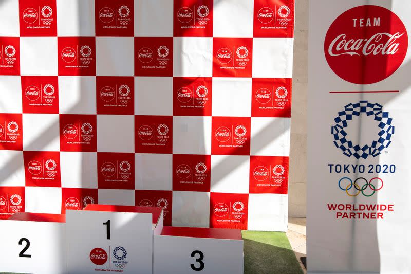 A banner advertising Worldwide Olympic Partners' Coca-Cola beverages is pictured at J-village compound ahead of the upcoming Olympics torch relay in Nahara town, Fukushima prefecture