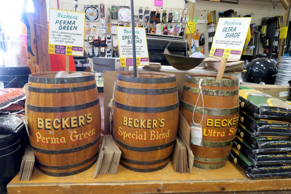 Barrels filled with grass seed blends are shown at Becker Hardware in Colts Neck Thursday, March 9, 2023.  The fixture along Route 34 is closing its doors after 120 years in business, including more than 50 years at its current location.