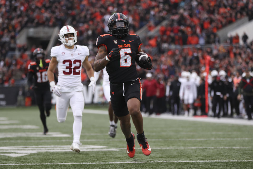 FILE -Oregon State running back Damien Martinez (6) rushes against Stanford during the first half of an NCAA college football game Saturday, Nov. 11, 2023, in Corvallis, Ore. Oregon State running back Damien Martinez, Miami running back Henry Parrish and Pitt defensive end Jayon Hayes entered the transfer portal as the 14-day spring window opened for college football players. (AP Photo/Amanda Loman, File)