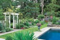 <p>The homeowner of this Connecticut cottage built a fence close to the pool for intimacy, then added evergreens and a variety of complementary color plants to create a secluded space around their pool.</p><p><strong><a href="https://www.countryliving.com/gardening/garden-tours/g143/garden-makeover-0205/" rel="nofollow noopener" target="_blank" data-ylk="slk:Read more about this Connecticut cottage;elm:context_link;itc:0;sec:content-canvas" class="link ">Read more about this Connecticut cottage</a>.</strong> </p>