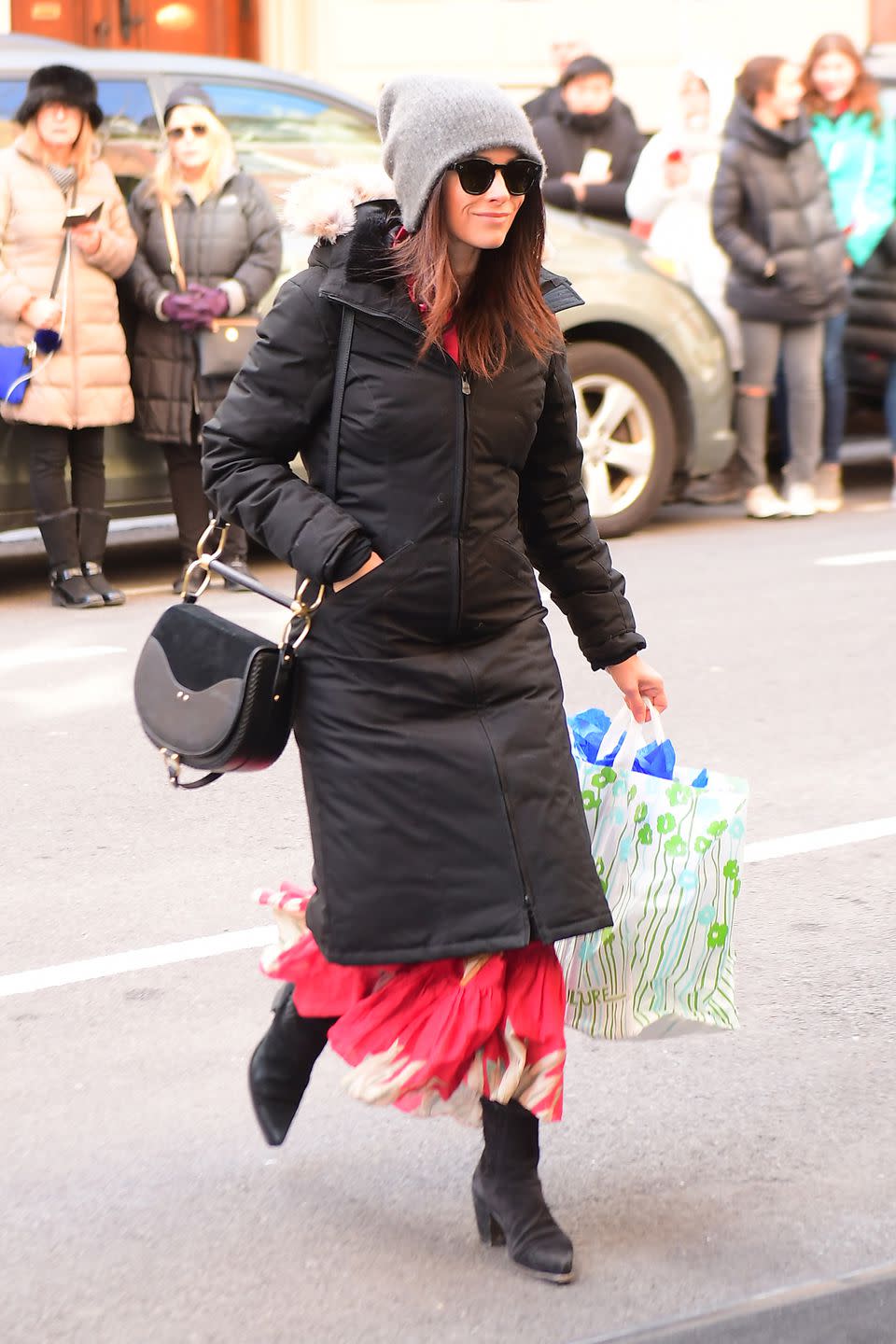 <p>Actress Abigail Spencer arrives bundled up to The Mark Hotel carrying a gift bag. </p>