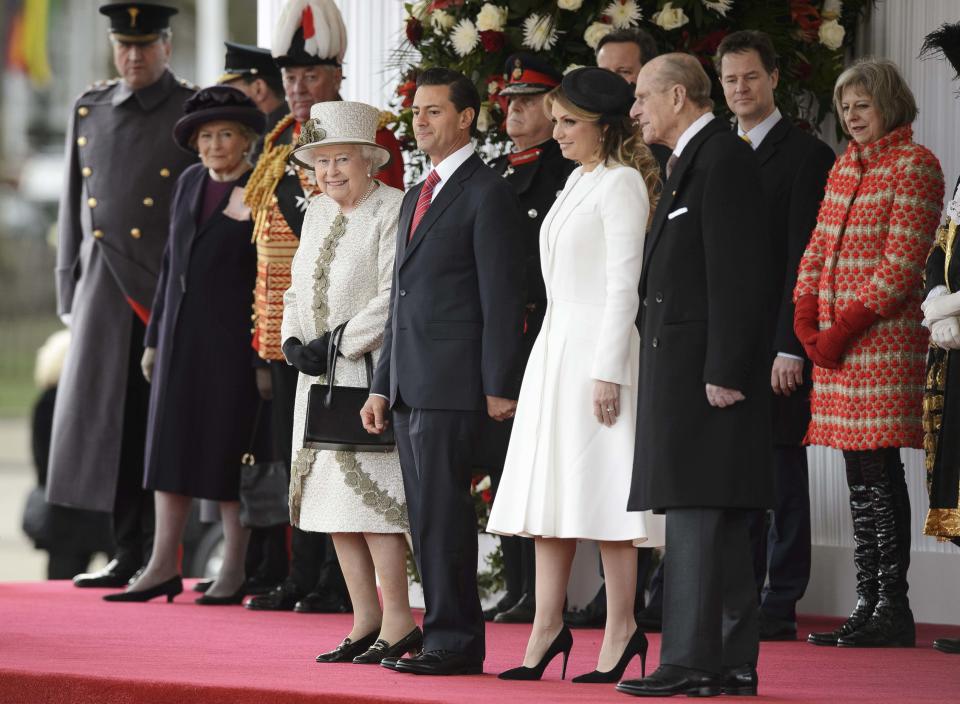 Britain's Queen Elizabeth II, President of Mexico Enrique Pena Nieto and his wife Angelica Rivera, and Britain's Prince Philip prepare to listen to the national anthem during a Ceremonial Welcome in central London