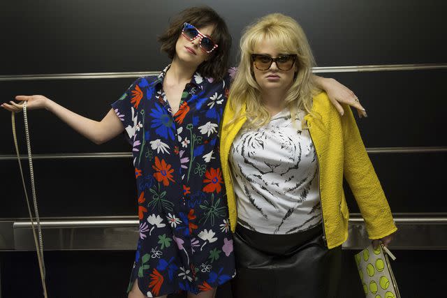 <p>Barry Wetcher/Flower/New Line Cinemas/Warner Bros/Kobal/Shutterstock </p> Dakota Johnson and Rebel Wilson in <i>How to Be Single</i>, 2016