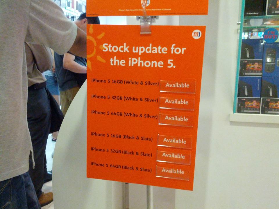 Boards showing the availability of iPhone 5 stocks can be see outside M1 stores around Singapore. (Yahoo! photo)