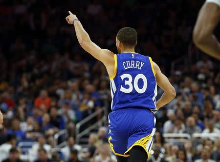 Jan 22, 2017; Orlando, FL, USA;Golden State Warriors guard Stephen Curry (30) reacts after scoring against the Orlando Magic during the second quarter at Amway Center. Mandatory Credit: Kim Klement-USA TODAY Sports