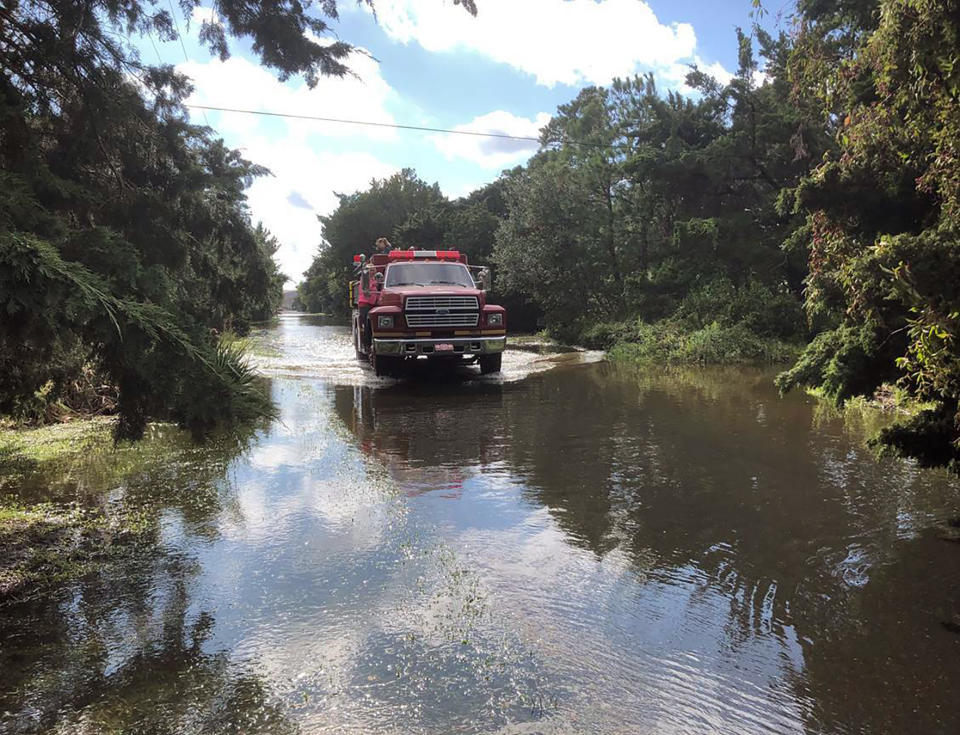 The Ocracoke Volunteer Fire Department makes rounds through the village on Friday, Sept. 6, 2019 on Ocracoke Island, N.C., in the aftermath of Hurricane Dorian. (Connie Leinbach/Ocracoke Observer via AP)