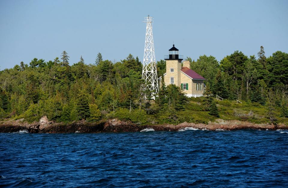 The waves of Lake Superior chop as the Copper Harbor Light Lighthouse (1848)  greets visitors coming back from Isle Royale  National Park in far northern  Lake Superior.