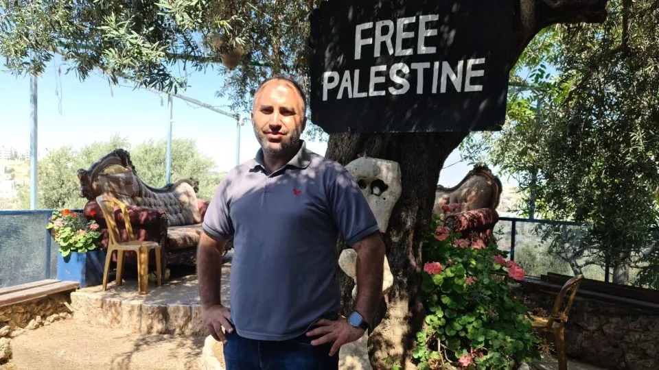 Issa Amro is seen in the garden of his house in Hebron. - Courtesy of Issa Amro
