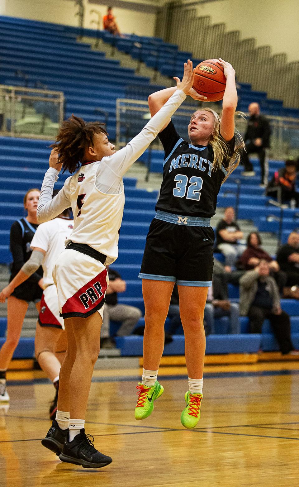 Mercy's Alyssa Murphy dropped in two of her 8 points against the PRP defense during the 6th Region Girls semifinal at Valley High School. The Mercy Jaguars defeated the PRP Panthers, 75-44. March 3, 2022