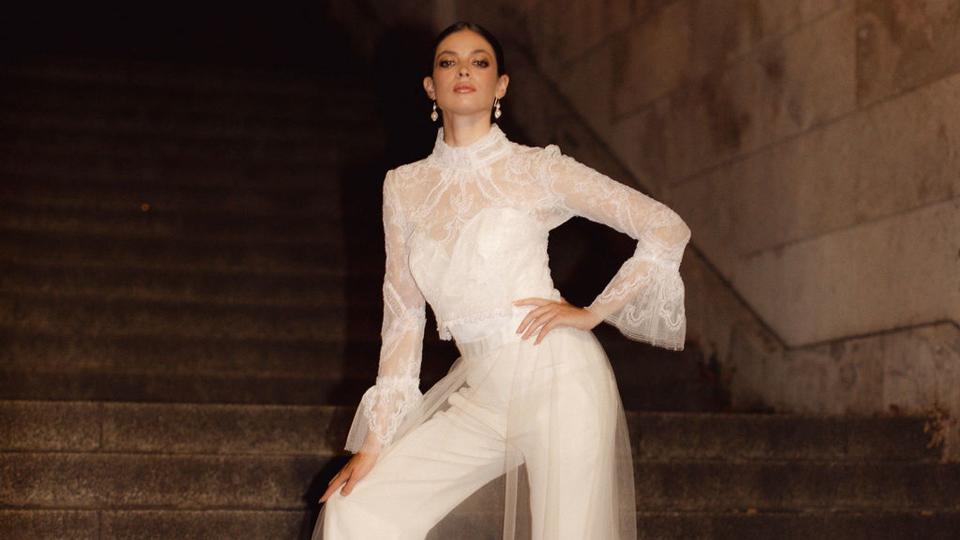 Bride with a lace jumpsuit on a set of steps