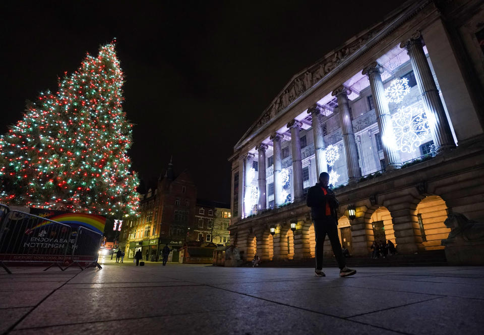 The Christmas tree lit up on a quiet evening in Nottingham city centre. (Photo by Zac Goodwin/PA Images via Getty Images)