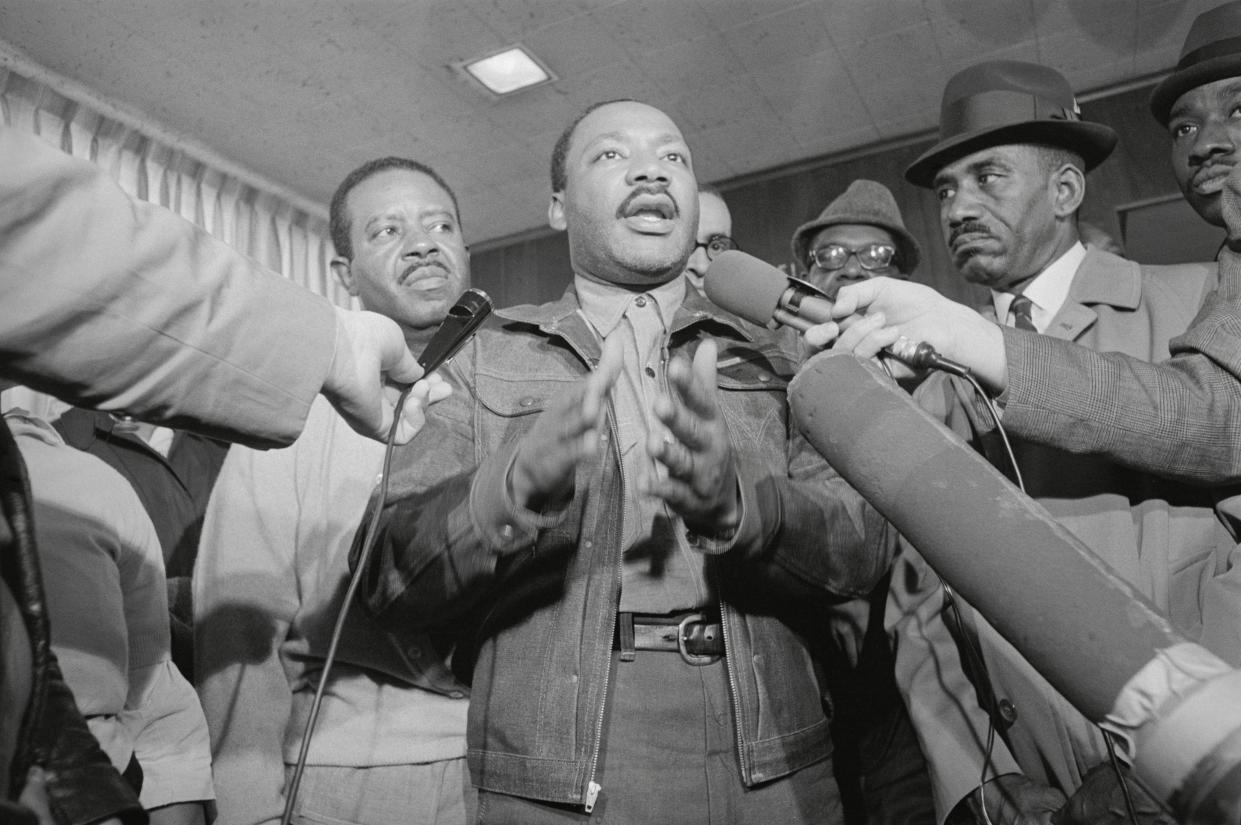 King and the Rev. Ralph Abernathy, left, are met by reporters as they emerge from the Jefferson County jail in Birmingham, Ala., on Nov. 6, 1967. (Photo: Bettmann/Getty Images)