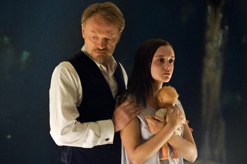 This image released by Lionsgate shows Jared Harris, left, and Olivia Cooke in a scene from "The Quiet Ones." (AP Photo/Lionsgate, Chris Harris)