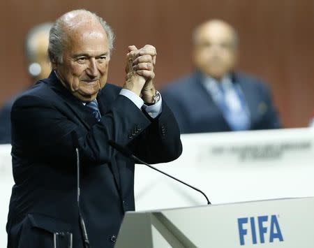 FIFA President Sepp Blatter gestures after he was re-elected at the 65th FIFA Congress in Zurich, Switzerland, May 29, 2015. REUTERS/Arnd Wiegmann