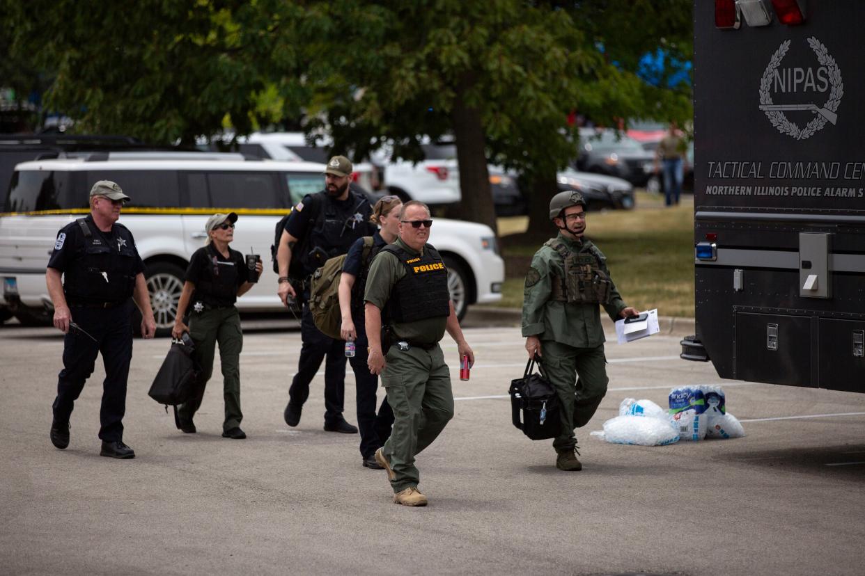 First responders work the scene of a shooting at a Fourth of July parade on July 4, 2022 in Highland Park, Illinois. Reports indicate at least five people were killed and 19 injured in the mass shooting.