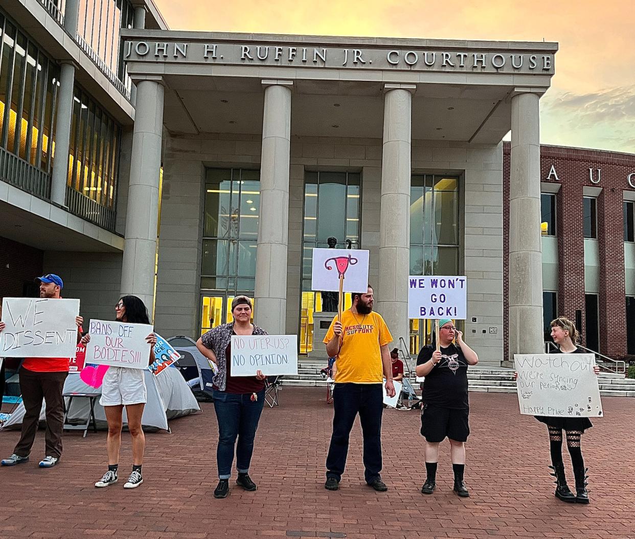 Reproductive rights activists protest the Supreme Court's repeal of Roe v. Wade outside the Augusta Judicial Center on James Brown Boulevard in Augusta, GA, on June 25, 2022. They camped outside the courthouse as praise to District Attorney Jared Williams, who committed to not prosecuting abortion seekers or providers.