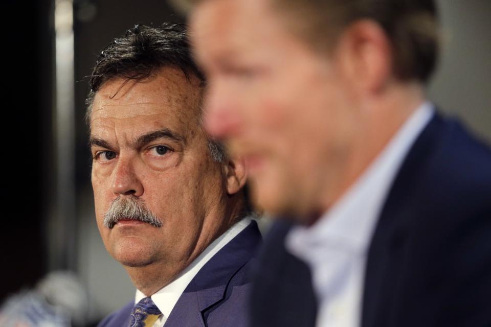 What is Jeff Fisher, left, thinking here as he looks at Los Angeles Rams GM Les Snead? (AP)