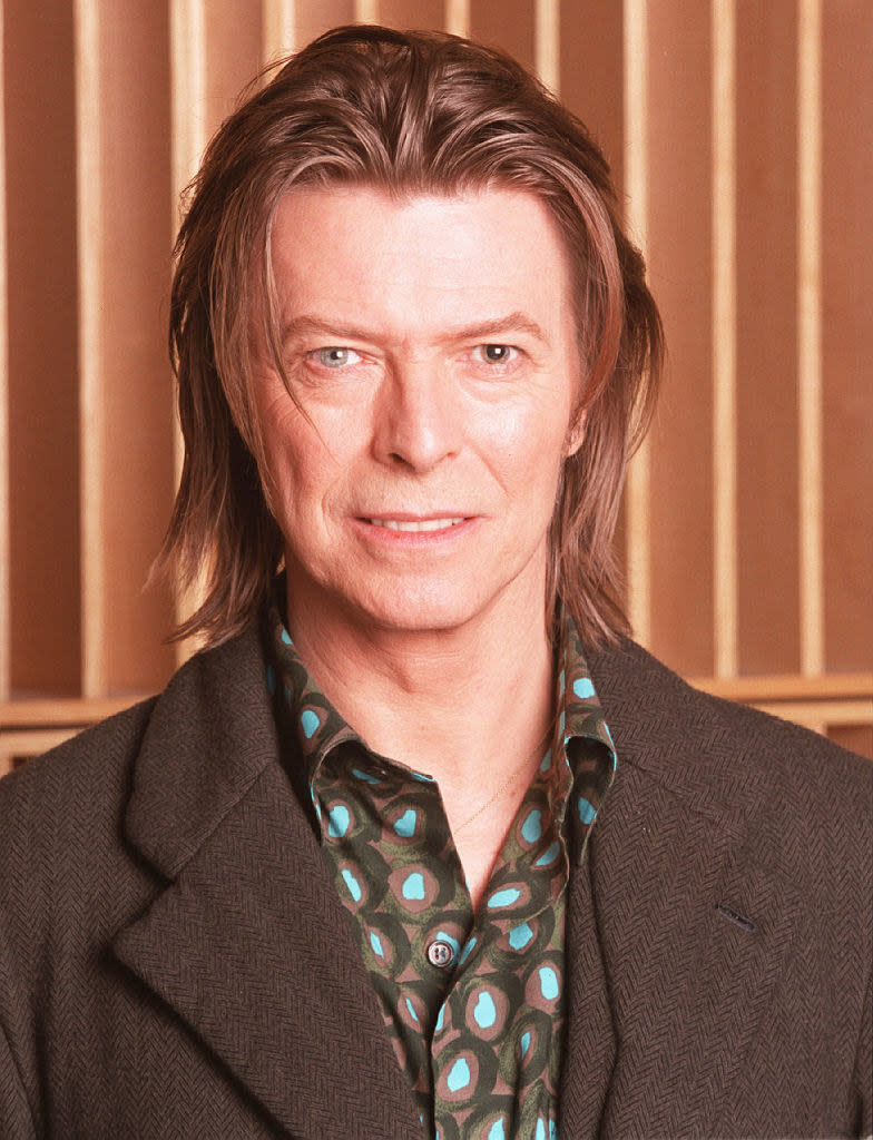 Musician David Bowie appears during a live radio interview with Radio One DJ's Mark and Lard at the Radio One Maida Vale studio