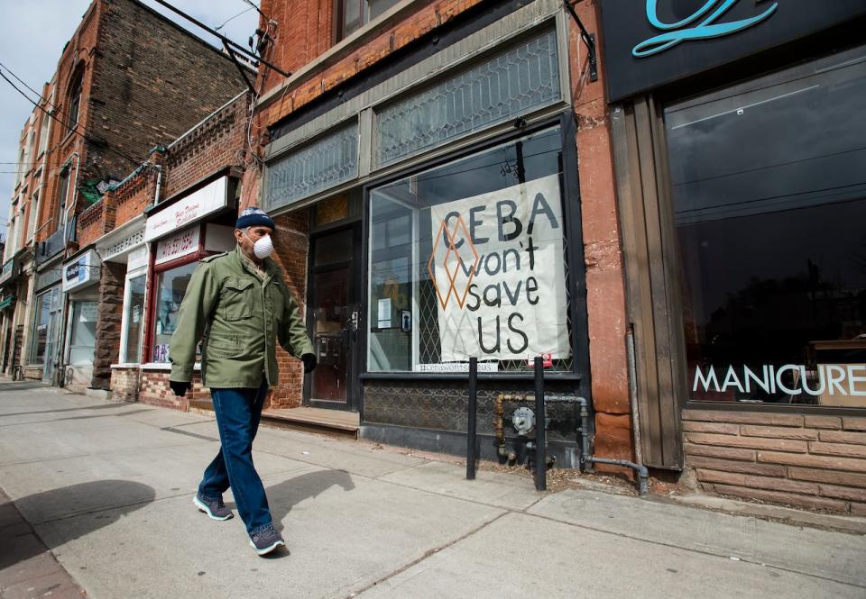 A closed store front boutique business called Francis Watson pleads for help displaying a sign in Toronto on Thursday, April 16, 2020. Prime Minister Justin Trudeau is expected to announce today significant rent relief to help businesses that can't afford to pay their landlords at a time when their operations are shut down due to the COVID-19 pandemic.