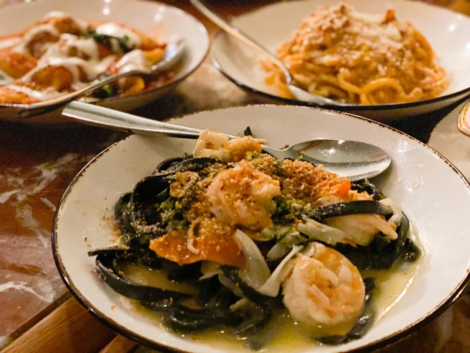 Fettucine Nero on Andrew Michael Italian Kitchen's weekly Family Night menu on Mondays. This lemony pasta features  house-made squid ink pasta and Royal Red shrimp.