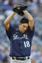 Seattle Mariners pitcher Yusei Kikuchi wipes sweat from his brow during the first inning of a baseball game against the Kansas City Royals at Kauffman Stadium in Kansas City, Mo., Saturday, Sept. 18, 2021. (AP Photo/Colin E. Braley)