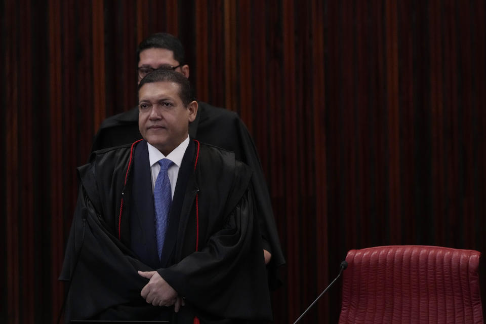 Minister of the Supreme Electoral Court Kassio Nunes Marques arrives for the trial of former President Jair Bolsonaro at the Supreme Court in Brasilia, Brazil, Friday, June 30, 2023. The panel of judges voted Friday to render Bolsonaro ineligible to run for office again after concluding that he abused his power and cast unfounded doubts on the country’s electronic voting system. (AP Photo/Eraldo Peres)