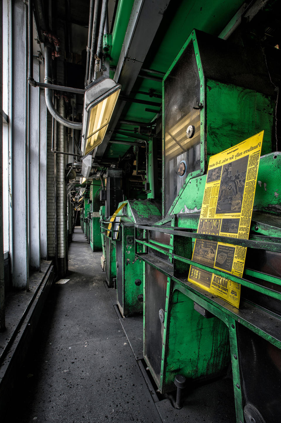 Stop the presses! Photographer documents newspaper’s eerie abandoned printing presses.