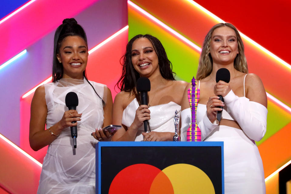 LONDON, ENGLAND - MAY 11: Leigh-Anne Pinnock, Jade Thirlwall and Perrie Edwards of Little Mix on stage after winning the British Group award during The BRIT Awards 2021 at The O2 Arena on May 11, 2021 in London, England. (Photo by JMEnternational/JMEnternational for BRIT Awards/Getty Images)