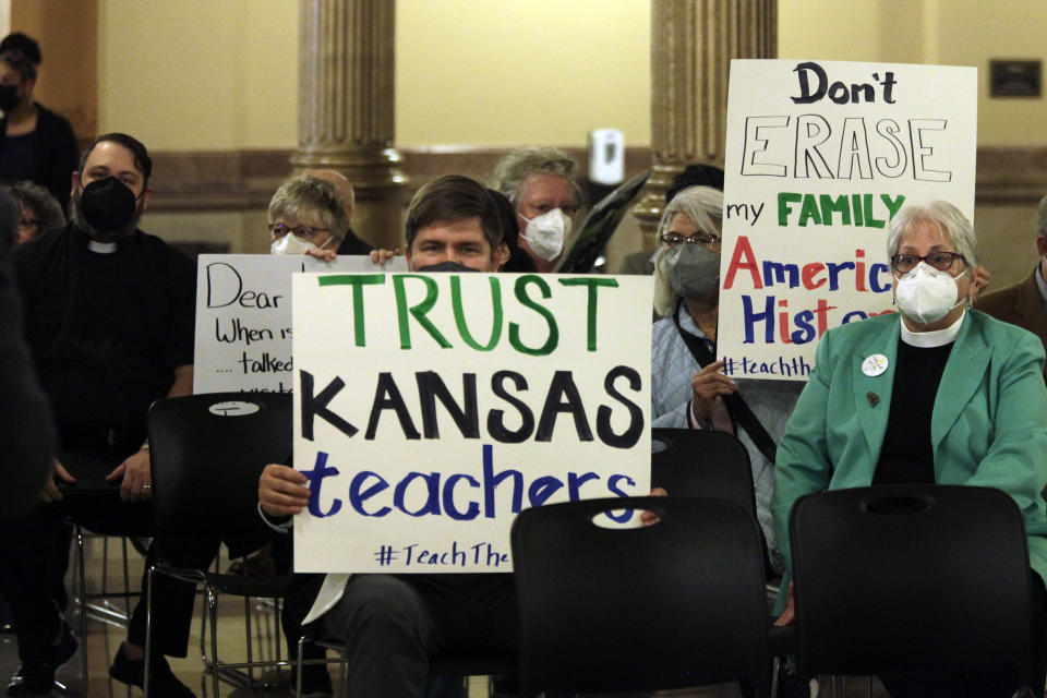 Educators, ministers and civil rights activists protest against legislative proposals to give people outside the public school system more power to shape what goes on in classrooms, on Tuesday, Feb. 15, 2022, at the Statehouse in Topeka, Kan. Conservatives argue that they're promoting transparency and empower parents. (AP Photo/John Hanna)