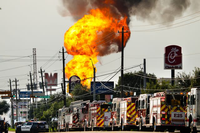 <p>Brett Coomer/Houston Chronicle via Getty</p> Emergency vehicles line Spencer Highway responding to a pipeline fire near Spencer and Summerton on Monday, Sept. 16, 2024 in La Porte. The fire caused road closures and shelter-in-place advisories Monday afternoon in the area, with evacuations to homes and businesses in the immediate area near the fire site.