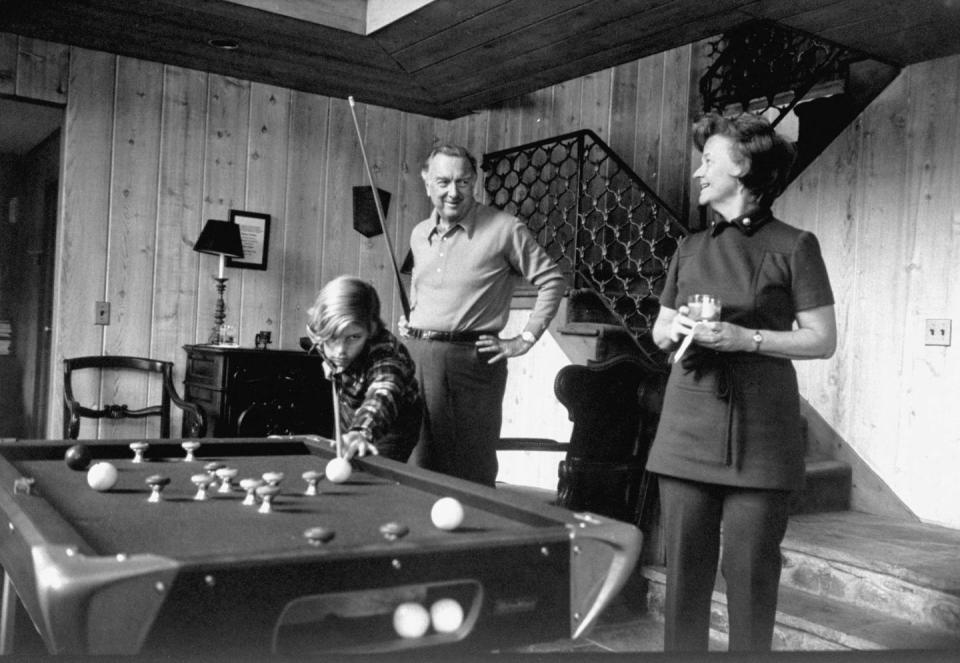 <p>Walter Cronkite plays pool with his wife, Betsy, and son, Chip, at home in 1971.</p>